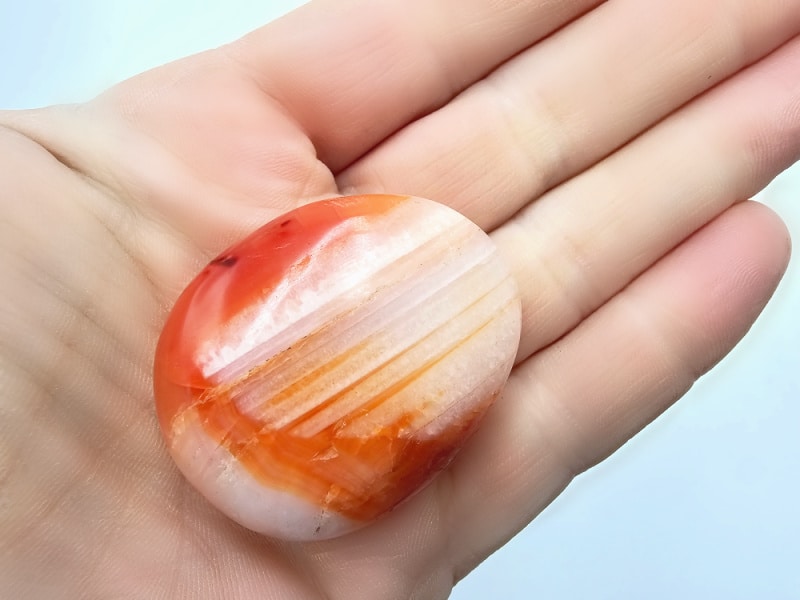 carnelian palm stone, orange with white shade, gemstone, crystals, fire element