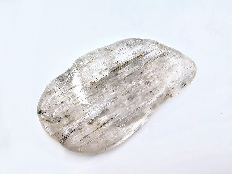 kunzite polished stone, clear with a bit of black, crystal, polished