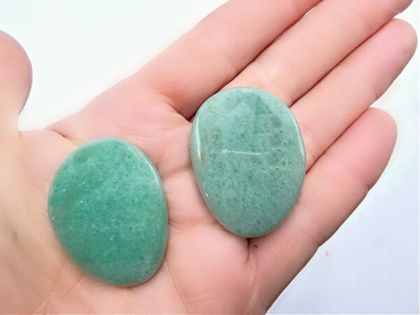 Green Aventurine Flat Palm stones in hand, lucky crystal