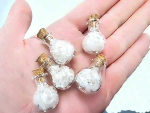 Clear quartz chips in a mini bottle
