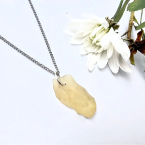 Libyan desert glass pendant on a stainless steel chain