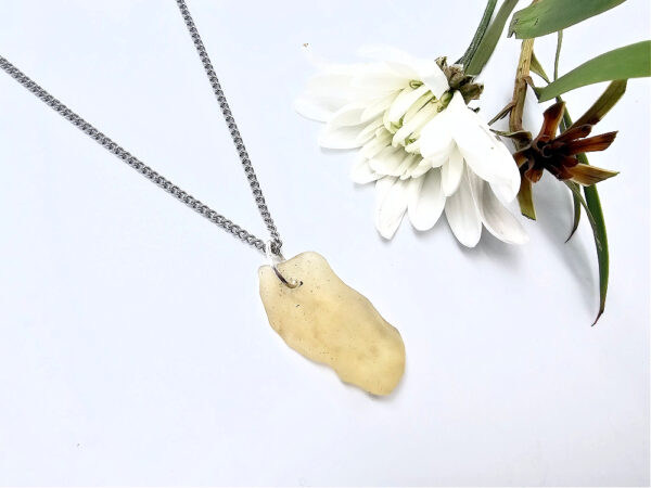 Libyan desert glass pendant on a stainless steel chain