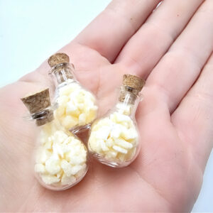 Mini bottle of orange calcite chips