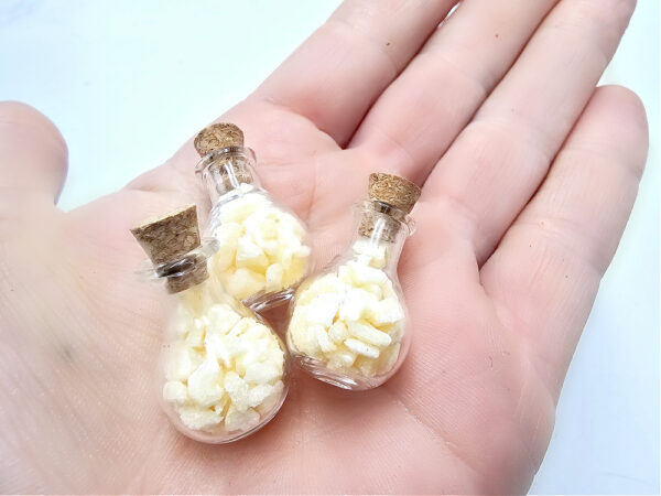 Mini bottle of orange calcite chips