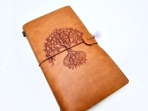 Tan colour journal with a tree of life cover